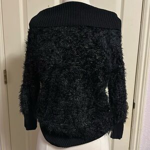 Like new condition cute sparkly off the shoulder BeBe sweater. M